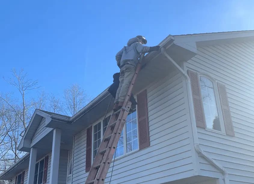 Gutter cleaning and maintenance being performed by Brook Park Power Washing in Brook Park