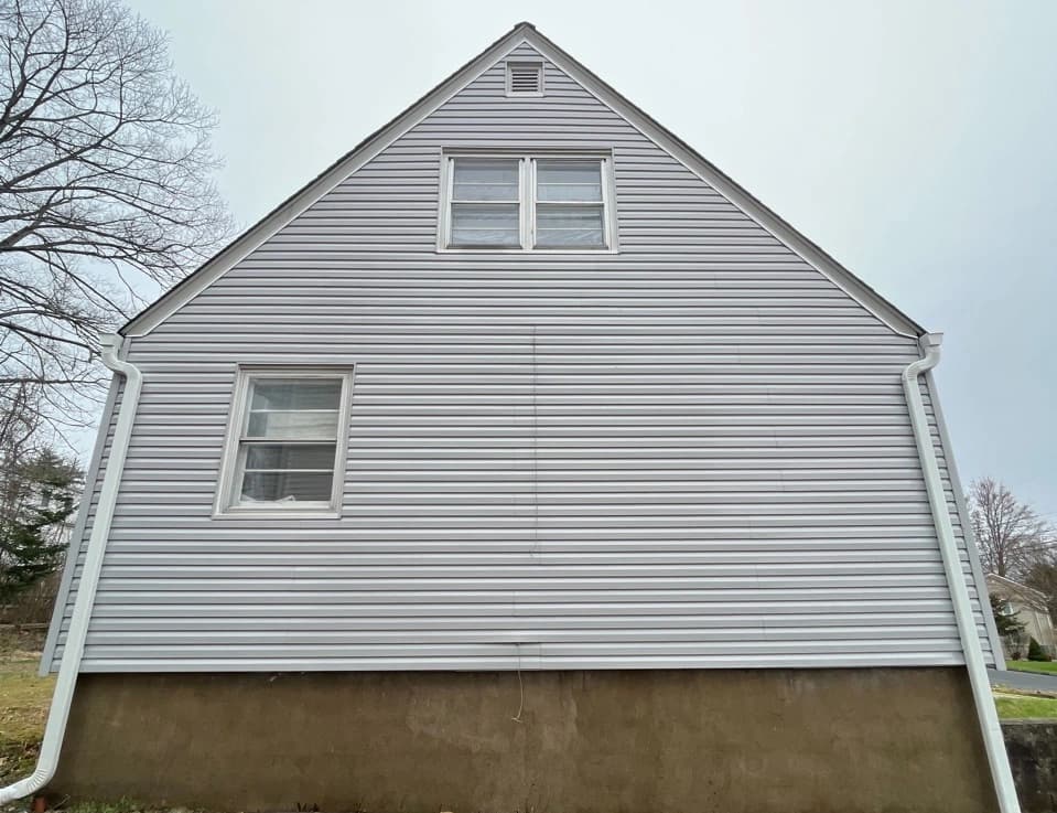 Brook Park Power Washing technician performing detailed house washing in Brook Park residential area